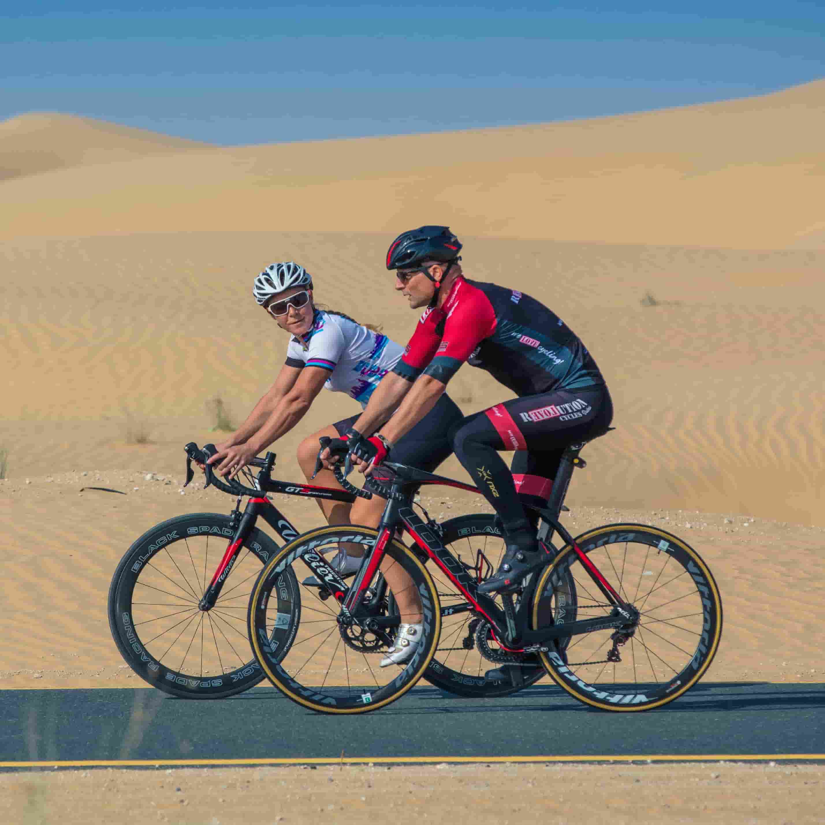 Cycling on a road in the Dubai desert