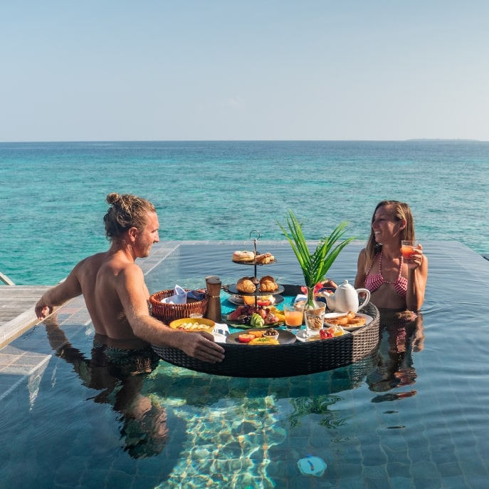 Couple eating in the Maldives