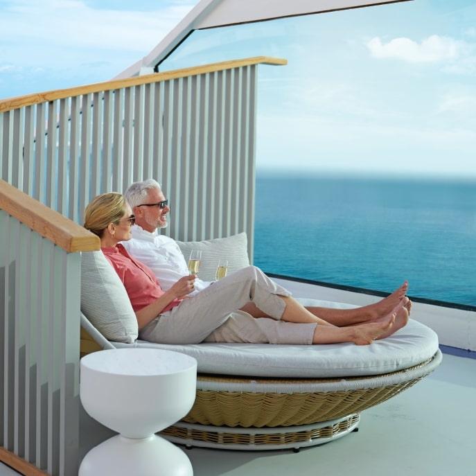 Couple on Oceania cruise balcony